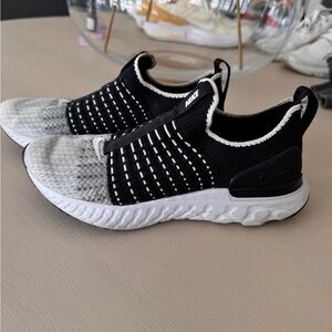 Nike Flyknit Black and White Slip-On Sneakers